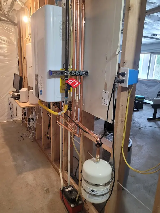 Licensed plumber repairing a kitchen sink in DeCordova